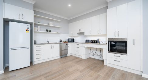 Kitchen of SDA apartment featuring raiseable bench