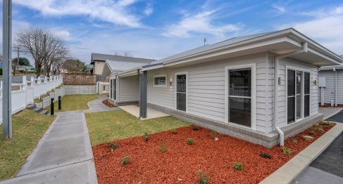 exterior of SDA property with wide paths and paved driveway