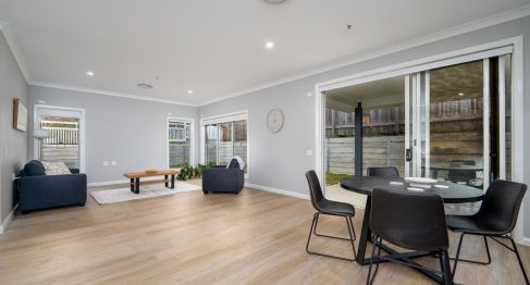 Dining room table and sofa in open plan living space